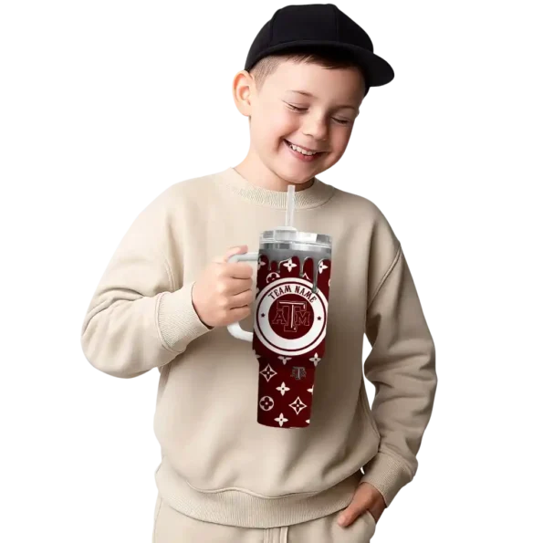 personalized texas am aggies bullseye drips maroon curved tumbler latest model.webp