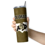 personalized-colorado-buffaloes-torn-band-gold-white-skinny-tumbler-best-selling.webp